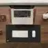 a laptop computer sitting on top of a wooden desk