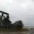 an oil pump sitting on top of a dirt field